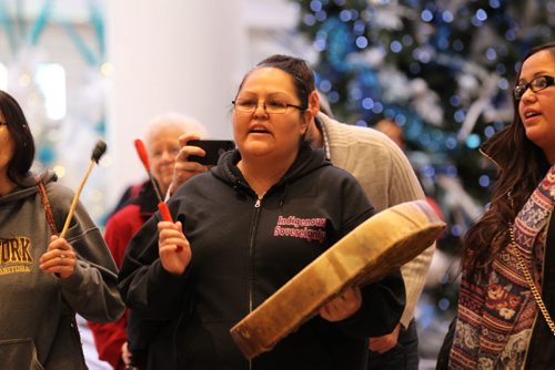 A traditional Cree womens drum circle called Keewatin Otchitchak played a gentle welcome song to both families to greet them as they made their way down the escalator at the airport in Winnipeg Saturday.  See MA story.  Dec 18, 2015 Ruth Bonneville / Winnipeg Free Press