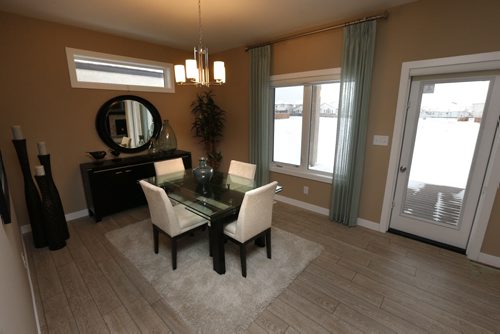 Homes 19 Cotswold Place in River Park South. The dining area and door to the back deck.  The Qualico sales rep is Brenda Johnson.  Todd Lewys story Wayne Glowacki / Winnipeg Free Press Dec. 21  2015