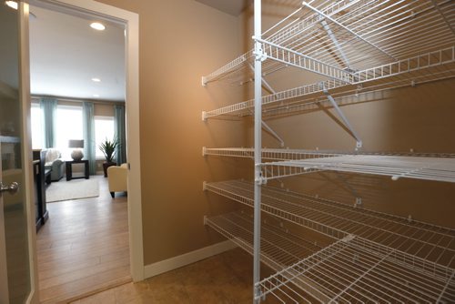 Homes 19 Cotswold Place in River Park South. The walk through pantry off of the kitchen. The Qualico sales rep is Brenda Johnson.  Todd Lewys story Wayne Glowacki / Winnipeg Free Press Dec. 21  2015