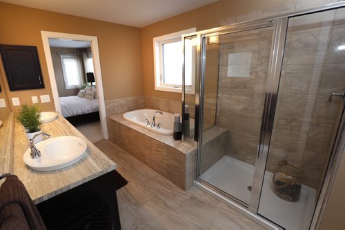 Homes 19 Cotswold Place in River Park South. The bathroom off of the master bedroom. The Qualico sales rep is Brenda Johnson.  Todd Lewys story Wayne Glowacki / Winnipeg Free Press Dec. 21  2015