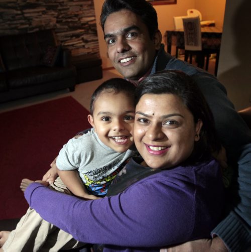 Retaining Refugees - Jyoti Balhara (bottom) poses with the husband Pardeep Punia and son Arjun (3) Monday. See Inayat Singh story. (ALTHOUGH THE STORY IS SLUGGED RETAINING REFUGEES, NIETHER OF THIS COUPLE WERE REFUGEES.  December 21, 2015 - (Phil Hossack / Winnipeg Free Press)