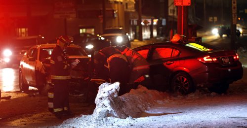 Winnipeg Fire Paramedics at the scene of a motor vehicle crash on Logan Ave. near Lizzie St. Tuesday morning.  At least one was sent to the hospital. Wayne Glowacki / Winnipeg Free Press Dec. 22  2015