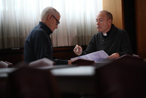 Christmas Front: Parish - St. Paul the Apostle, Father Eric Giddens  Father Giddens meets with parish trustee, Frank Barnes,  discussing sponsoring the new Syrian family that will  arrive in early in new year. See Paul Wiecek's story  Dec 22, 2015 Ruth Bonneville / Winnipeg Free Press