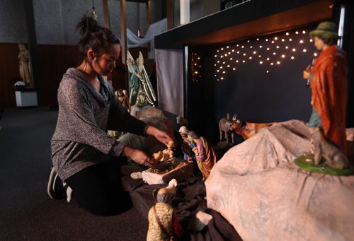 Christmas Front: Parish - St. Paul the Apostle. Parish member Kaelyn Oquendo places the figurine of baby Jesus in the nativity scene in front of the church.  See Paul Wiecek's story  Dec 22, 2015 Ruth Bonneville / Winnipeg Free Press
