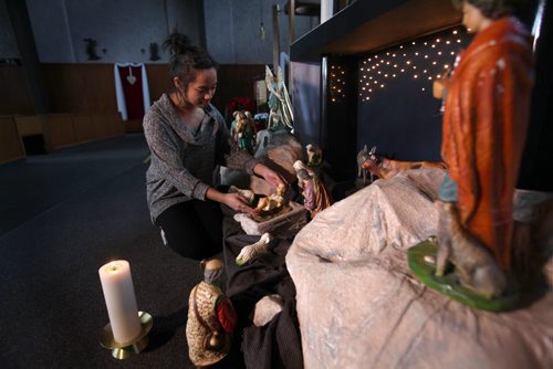 Christmas Front: Parish - St. Paul the Apostle. Parish member Kaelyn Oquendo places the figurine of baby Jesus in the nativity scene in front of the church.  See Paul Wiecek's story  Dec 22, 2015 Ruth Bonneville / Winnipeg Free Press