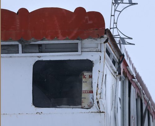 49.8  OLD BOATS.  A window at the stern of the Paddlewheel Queen in the frozen slough north of Selkirk, Mb.  Bill Redekop story   Wayne Glowacki / Winnipeg Free Press Dec. 22  2015