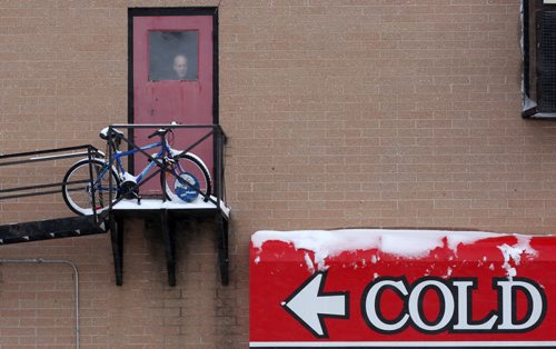 A man watches the blustery weather outside the Marion Hotel in Winnipeg Thursday afternoonStandup Photo- Dec 23, 2015   (JOE BRYKSA / WINNIPEG FREE PRESS)