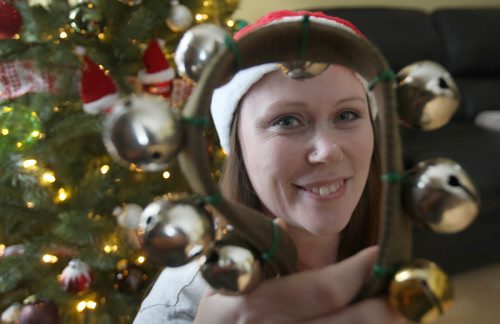 Teri Shellenberg holds Santa items ( bells and belt) she has that bring back memories of  her father Charlie Brow, not pictured dressing up like Santa for many yearsSee Gordon Sinclair Column- Dec 23, 2015   (JOE BRYKSA / WINNIPEG FREE PRESS)