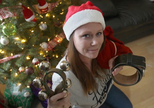 Teri Shellenberg holds Santa items ( bells and belt) she has that bring back memories of  her father Charlie Brow, not pictured dressing up like Santa for many yearsSee Gordon Sinclair Column- Dec 23, 2015   (JOE BRYKSA / WINNIPEG FREE PRESS)