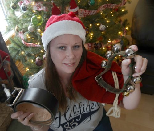 Teri Shellenberg holds Santa items ( bells and belt) she has that bring back memories of  her father Charlie Brow, not pictured dressing up like Santa for many yearsSee Gordon Sinclair Column- Dec 23, 2015   (JOE BRYKSA / WINNIPEG FREE PRESS)