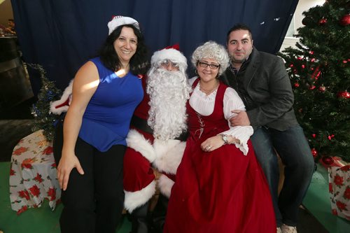 Friends Tony Russo and Rosy Infantino visit Santa Claus and Mrs. Claus at at the 10th annual Sons of Italy Christmas Eve Feast at X-Cues Billiards and Café on Dec. 24, 2015. Partners for the event included X-Cues, Sorrentos on Ellice and the West End BIZ. About 600 people were fed at the feast and 225 food hampers were distributed, as were gifts for about 250 children. Photo by Jason Halstead/Winnipeg Free Press RE: Social Page