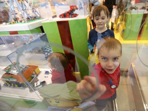 Clockwise from left, Aleena, 2, Daniel, 6, and Jakob, 5, who along with their parents, Jeremy and Jinelle Kehler, spent the day shopping together at Polo Park, Saturday, December 26, 2015. (TREVOR HAGAN / WINNIPEG FREE PRESS)