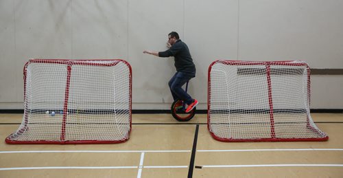 Peter Kisil is two hours into his first foray on a unicycle using the wall and the hockey nets for stability at the Winnipeg Circus Club, which has been taking over the Broadway Neighborhood Centre for a few months now, on Sunday afternoons. The group works on various disciplines - tightrope walking, juggling, unicycling... things that will help them if they ever decide to run away and join the circus.  151227 - Sunday, December 27, 2015 -  MIKE DEAL / WINNIPEG FREE PRESS