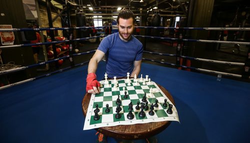 Sean Mooney is a former Winnipegger now working as a banker in New York.  He's also a chess boxer. A chess boxing match involves about five rounds of boxing and in between, you sit on your stool in the middle of the ring and play chess. You lose if you either get knocked out or your king gets taken. Reporter Geoff Kirbyson sparred with Sean Mooney in a couple rounds of chess boxing at Pan Am Boxing Club. 151228 - Monday, December 28, 2015 -  MIKE DEAL / WINNIPEG FREE PRESS