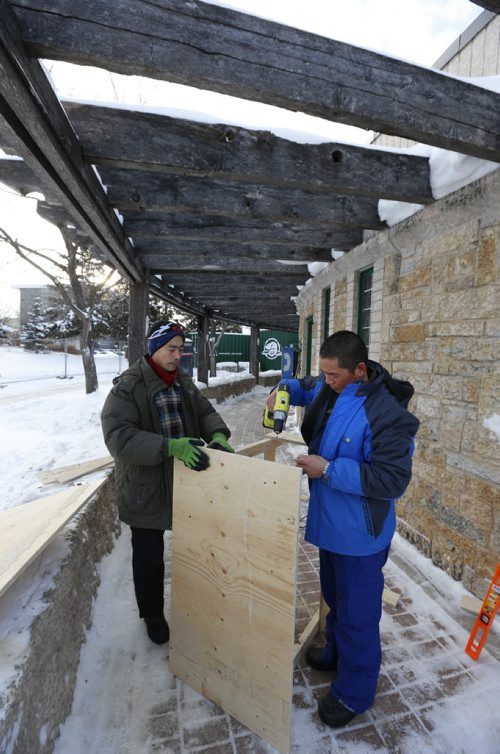 First things First.  Yuhe Zhang,right, and Yuzhu Ma two of the specially trained team of Chinese ice artisans in Winnipeg to create The Great Ice Show at The Forks. On Tuesday the pair built a table for their tools, the first ice blocks are expect to arrive from Birds Hill on Wednesday.   Story by Danielle Doiron Wayne Glowacki / Winnipeg Free Press Dec. 29  2015
