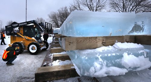 The first load of ice blocks cut from a pond in a Birds Hill gravel pit arrived at The Forks Wednesday on a flat bed that will be used by the team of Chinese ice artisans in Winnipeg to create The Great Ice Show. Each of the 250-kilogram blocks was carefully carried to the site by fork lift. These blocks will form the base of a snow and ice sculpture winter wonderland modelled after the largest ice festival in the world, the Harbin International Ice and Snow Sculpture Festival in Harbin, China. They hope to open The Great Ice Show in the third week of January. see  Danielle Doiron  for more info. Wayne Glowacki / Winnipeg Free Press Dec. 30  2015