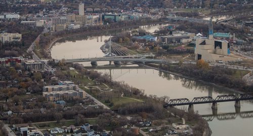 Winnipeg skyline aerial photos for the Red, Assiniboine, La Salle, and Seine River Project. The Esplanade Reil, Canadian Museum for Human Rights and The Forks border the Red River as the sun sets. 151026 - Monday, October 26, 2015 -  MIKE DEAL / WINNIPEG FREE PRESS