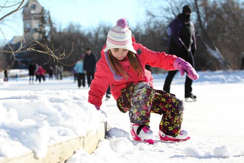 Seven-year-old Emilie Lavalle learns to skate for the first time while with her family on the Duck Pond at Assiniboine Park on New Year's Day.   Standup  Jan 01, 2016 Ruth Bonneville / Winnipeg Free Press