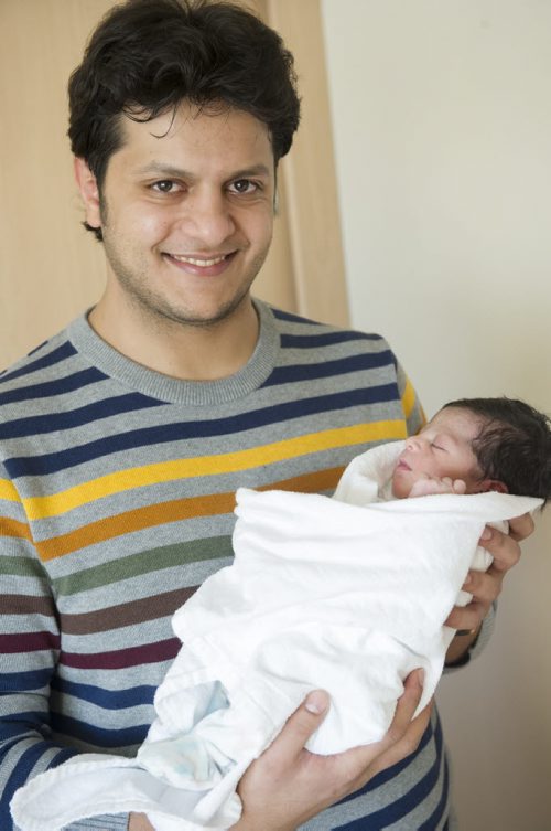 DAVID LIPNOWSKI / WINNIPEG FREE PRESS 160101  Father Faiez Alshafa with his newborn daughter Fay, was born at St. Boniface Hospital 12:14AM New Years Day January 1, 2016.