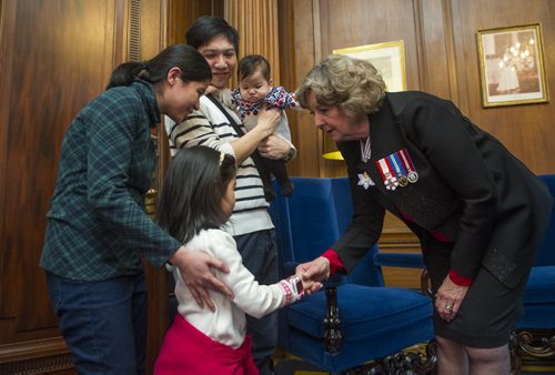 DAVID LIPNOWSKI / WINNIPEG FREE PRESS 160101  Lieutenant Governor Janice Filmon greets 6-year-old Georgia Biscotto and her family father Jose, mother Anna, sister Bella (7-months-old) at the New Year's Levee at the Manitoba Legislature Building January 1, 2016.