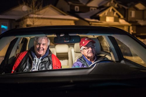 David George and Wally Stoyko, volunteers with Operation Red Nose, pull up to a house in East St. Paul on New Year's Eve, December 31, 2015. (GREG GALLINGER / WINNIPEG FREE PRESS)