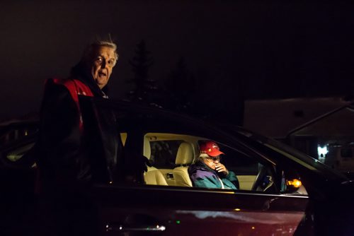 David George and Wally Stoyko, volunteers with Operation Red Nose, arrive at a house in Transcona to pick up a woman headed home to Island Lakes. December 31, 2015. (GREG GALLINGER / WINNIPEG FREE PRESS)