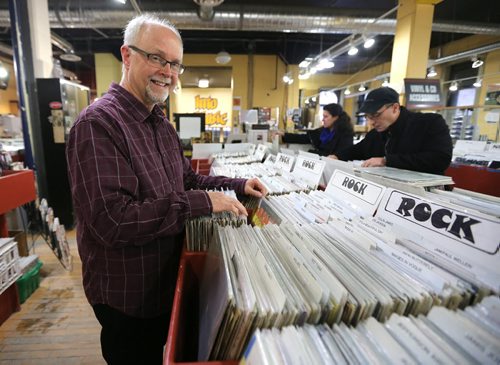 Winnipeg professor and music writer John Einarson check out vinyl records at Into The Music in the Exchange on Jan. 2, 2016. Photo by Jason Halstead/Winnipeg Free Press RE: Story on boom in vinyl record sales