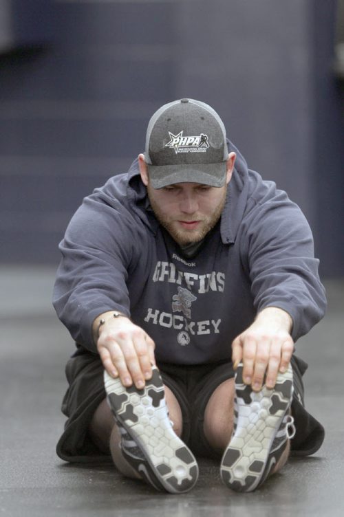 Grand Rapids Griffins player Triston Grant, who is from Neepawa, Manitoba was busy stretching Monday at the MTS Centre in Winnipeg- He is coming off a injury and will be returning to the ice tomorrow-See Melissa Martin- Jan 04, 2016   (JOE BRYKSA / WINNIPEG FREE PRESS)