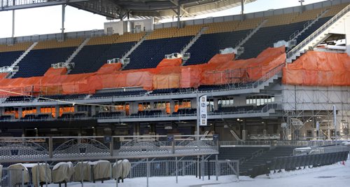 Orange tarpaulins and the sound of jackhammers in Investors Group Field Monday morning. Wayne Glowacki / Winnipeg Free Press Jan. 4 2016