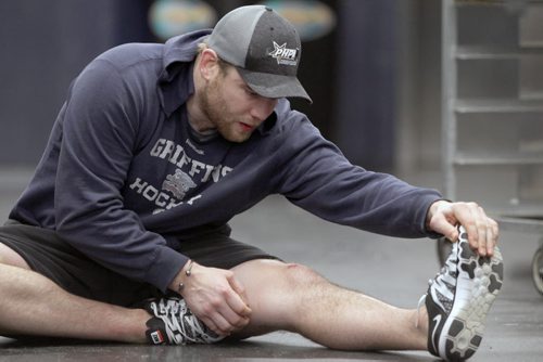 Grand Rapids Griffins player Triston Grant, who is from Neepawa, Manitoba was busy stretching Monday at the MTS Centre in Winnipeg- He is coming off a injury and will be returning to the ice tomorrow-See Melissa Martin- Jan 04, 2016   (JOE BRYKSA / WINNIPEG FREE PRESS)