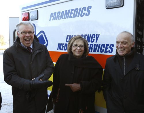 From left, Premier Greg Selinger and Oksana Bondarchuk, president of the Ukrainian Canadian Congress-Manitoba Provincial Council and David Chomiak,MLA at the announcement Monday that the Manitoba Gov't will donate three previously used ambulances to the Humanitarian Ambulances for Ukraine Project. The Ukrainian Canadian Congress-Manitoba Provincial Council  will be contributing a fourth ambulance. The news conference was held in front of the Manitoba Legislative Bld.  Bart Kives story. Wayne Glowacki / Winnipeg Free Press Jan. 4 2016