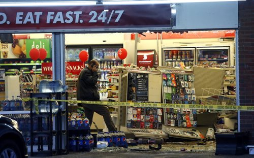 A vehicle crashed through the front window into the 7Eleven on St. Mary's Road at Sunset Blvd. in St. Vital Monday morning. The damage extends to the back of the store. Wayne Glowacki / Winnipeg Free Press Jan. 4 2016