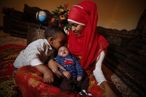 Monday, January 4, 2016 - Sagal Abdi Ali, a refugee from Somalia, is photographed with her two sons Ryaaz, 2, and Ridwan, 1 month, in her cousin's home Monday, January 4, 2016. Sagal was sponsored by her cousin and came to Canada is September. John Woods / Winnipeg Free Press