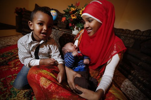 Monday, January 4, 2016 - Sagal Abdi Ali, a refugee from Somalia, is photographed with her two sons Ryaaz, 2, and Ridwan, 1 month, in her cousin's home Monday, January 4, 2016. Sagal was sponsored by her cousin and came to Canada is September. John Woods / Winnipeg Free Press