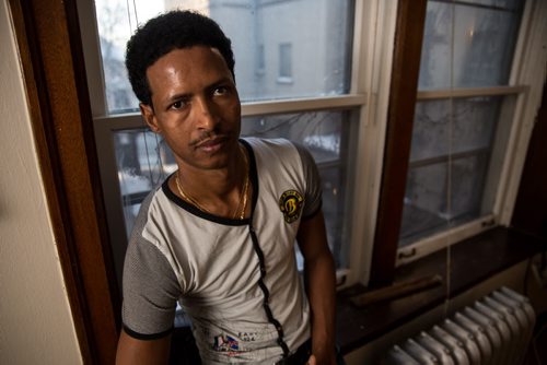 Simon Hagos, at his apartment of Broadway is an Eritrean refugee who arrived in January 2015. 160104 - Monday, January 4, 2016 -  MIKE DEAL / WINNIPEG FREE PRESS