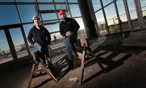 The "Brothers of Bargains", Andrew (left) and Doug MacIver, are in the middle of a $5-million expansion of their used car dealership. They're posing in what will be their new showroom at on Oak Point Highway. See Geoff Kirbyson's story. January 5, 2016 - (Phil Hossack / Winnipeg Free Press)