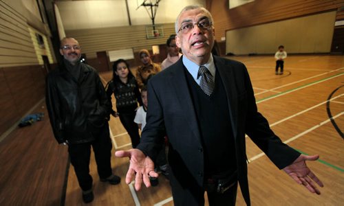 Organizer Ibrahim Eldessouky poses Tuesday evening with a group of parents and children who are seeking to have Arabic bilingual introduced in one or more public schools. See Nick Martin story.....January 5, 2015 - (Phil Hossack / Winnipeg Free Press)