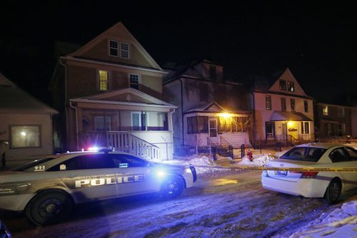 January 5, 2015 - 160105  -  Police investigate at tape off 503, 507 and 509 Young after reports of gunshots heard Tuesday, January 5, 2016. They were also investigating at 514 Spence. John Woods / Winnipeg Free Press