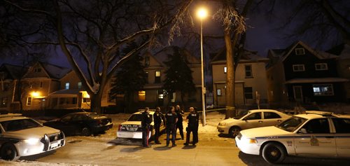 Winnipeg Police outside a house Wednesday morning in the 500 block of Spence Street after a man was shot Tuesday evening.  Wayne Glowacki / Winnipeg Free Press Jan. 6 2016