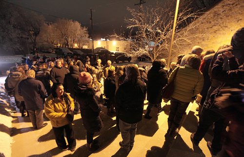 Nearly 300 residents wait outside the Stonewall United Church to attend a community meeting considering a conditional use permit allowing a Community Living home in the community. The meeting started in town council chambers but was quickly moved to the United Church to accomodate the three hundred or so attendies. Ashley Prest story. . January 7, 2015 - (Phil Hossack / Winnipeg Free Press)