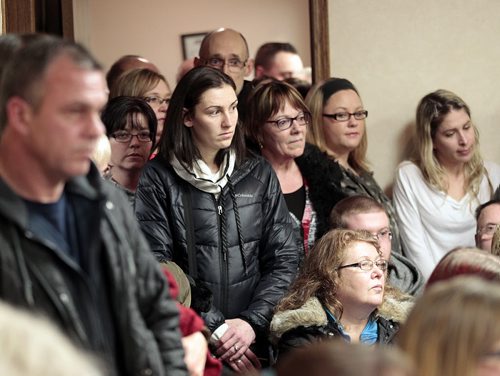 People try to squeeze into counsil chambers in Stonewall Wednesday evening at a meeting considering a conditional use permit for a special needs home, the meeting was quickly moved to the United Church to accomodate the three hundred or so attendies. Ashley Prest story. . January 7, 2015 - (Phil Hossack / Winnipeg Free Press)