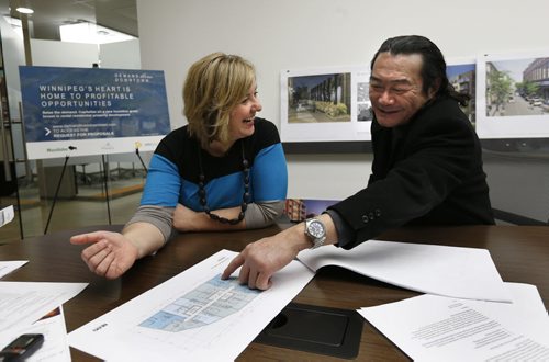 Local developer Albert Cheung will be building a new apartment complex on a surface parking lot at the foot of Market Avenue, he is with CentreVenture president and CEO Angela Mathieson. They are in the CentreVenture office.  Murray McNeill story Wayne Glowacki / Winnipeg Free Press Jan. 7 2016