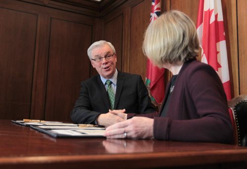 Premier Greg Selinger shakes  Alberta Premier Rachel Notley hand after they sign documents on energy infrastructure, renewable energy and climate-change priorities at the Legislative Building Friday.   Jan 08, 2016 Ruth Bonneville / Winnipeg Free Press