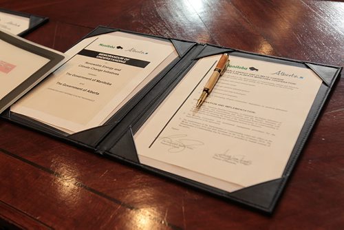Signed copies of documents that Alberta Premier Rachel Notley and Premier, Greg Selinger signed on energy infrastructure, renewable energy and climate-change priorities at the Legislative Building Friday.   Jan 08, 2016 Ruth Bonneville / Winnipeg Free Press