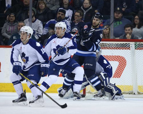 Manitoba Moose centre Patrice Cormier fights for space in front of Toronto Marlies goalie Rob Madore during American Hockey League action at the MTS Centre on Jan. 8, 2016. Photo by Jason Halstead/Winnipeg Free Press