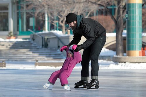 Paul Simpson skates with his daughter Eloise, almost 3yrs, under the canopy at the Forks Saturday morning.  Paul and his wife Suzanne want their kids Eloise and Madeleine - 4yrs to get out and enjoy Winnipeg's winter weather by dressing warm and keeping outings short so they enjoy the different seasons.   Standup Jan 09, 2016 Ruth Bonneville / Winnipeg Free Press