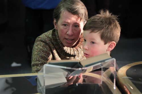 Six-year-old Henry Bak and his mom Grace look over one of Nellie McClung's novels called Purple Springs, just one many formal documents of womens suffrage in Manitoba that were on display at an open house  Saturday at the Archives Research Room at 200 Vaughan St.  The original records from the archives including the amendment Bill and publications from the Legislative Library were on display in celebration of the 100th anniversary of the first group of women to get the right to vote. See Kevin Rollason's story.  Jan 09, 2016 Ruth Bonneville / Winnipeg Free Press