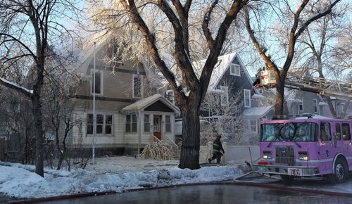 Firefighters continue to put out hotspots at a house that was completely destroyed by an early morning fire in the one hundred block of Cathedral Avenue.  160110 Sunday 10, 2016 Mike Deal / Winnipeg Free Press