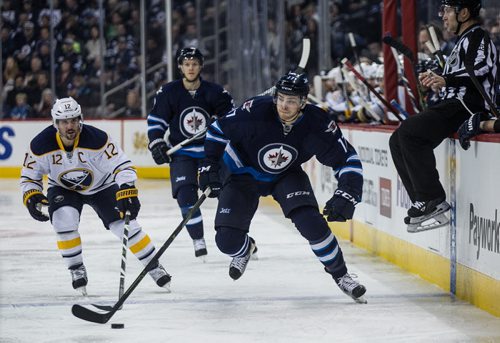 Winnipeg Jets' Adam Lowry (17) and Buffalo Sabres' Brian Gionta (12) during second period NHL action in Winnipeg on Sunday, January 10, 2016. 160110 - Sunday, January 10, 2016 -  MIKE DEAL / WINNIPEG FREE PRESS