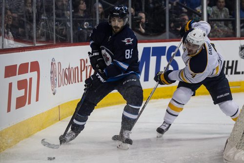 Winnipeg Jets' Mathieu Perreault (85) and Buffalo Sabres' Josh Gorges (4) during second period NHL action in Winnipeg on Sunday, January 10, 2016. 160110 - Sunday, January 10, 2016 -  MIKE DEAL / WINNIPEG FREE PRESS